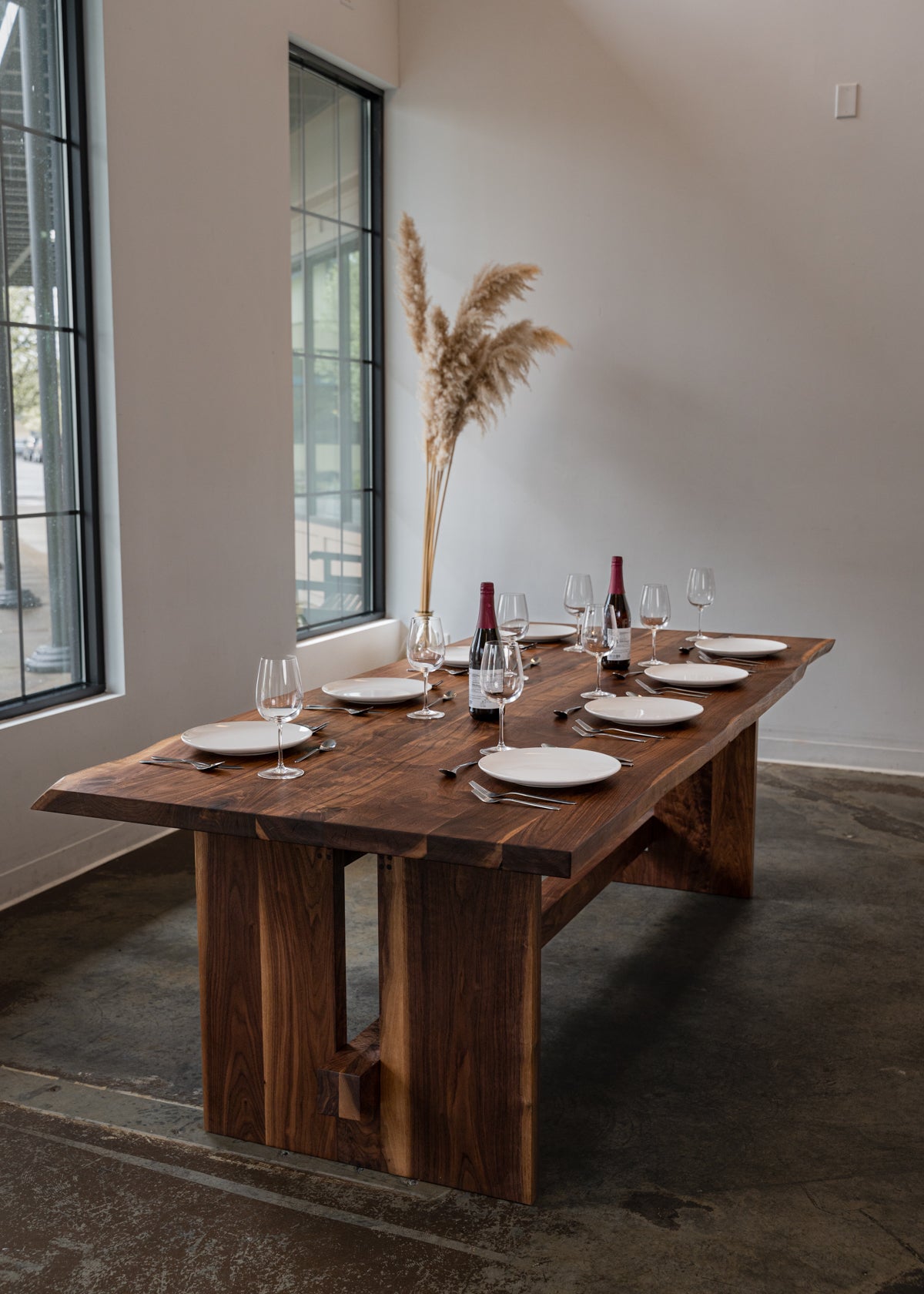 Dark wooden table with table settings 