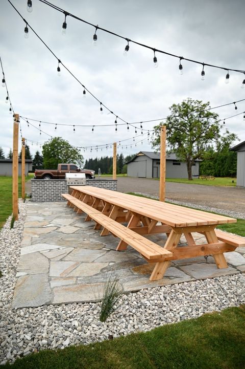 A long traditional wood picnic table 